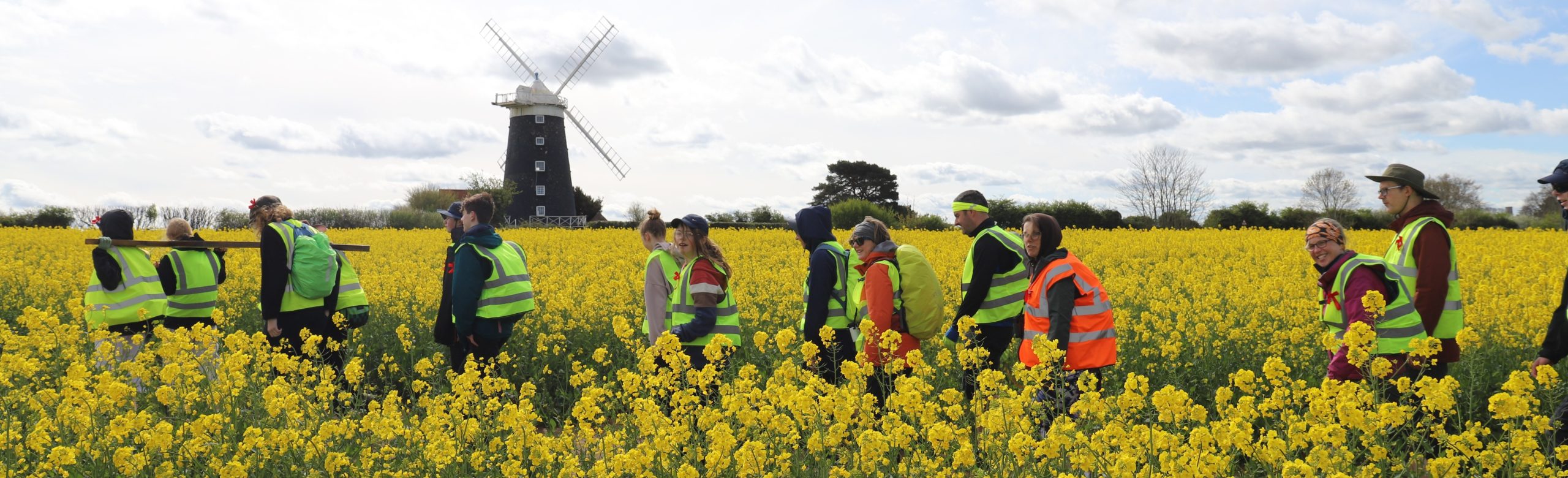 Pilgrims crossing a field in north Norfolk